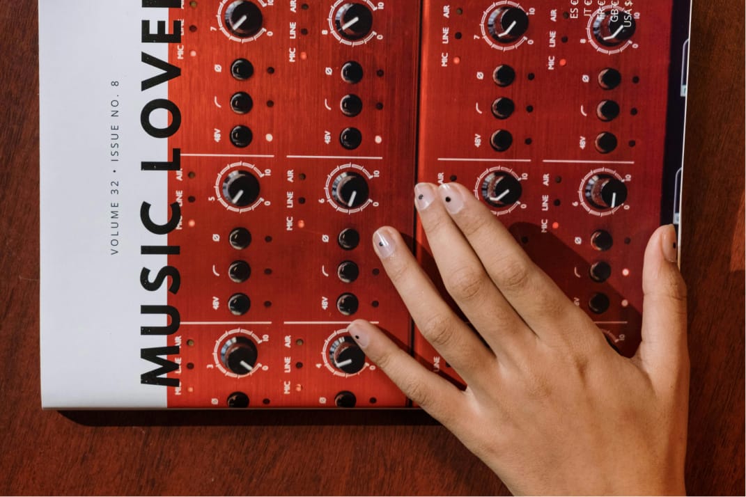 Hand reaching for a music magazine