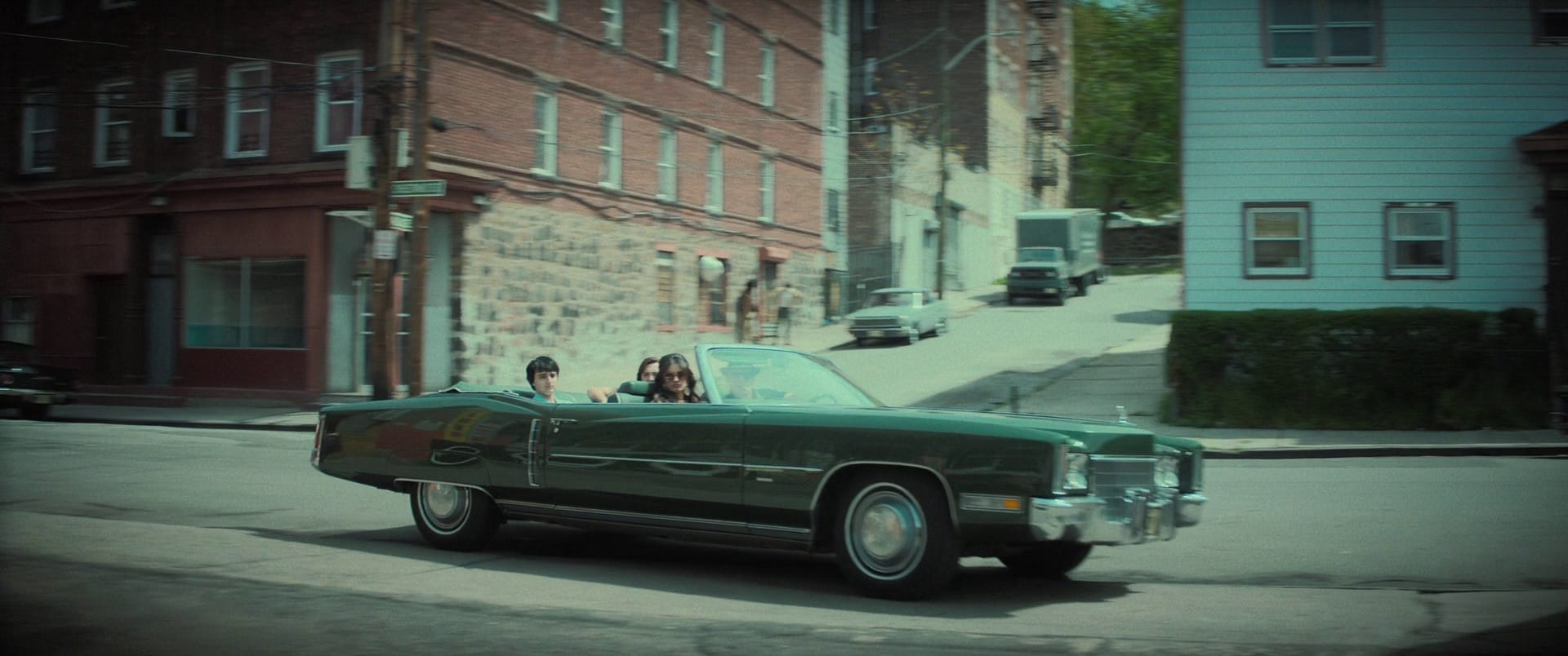 Young adults driving in a vintage car