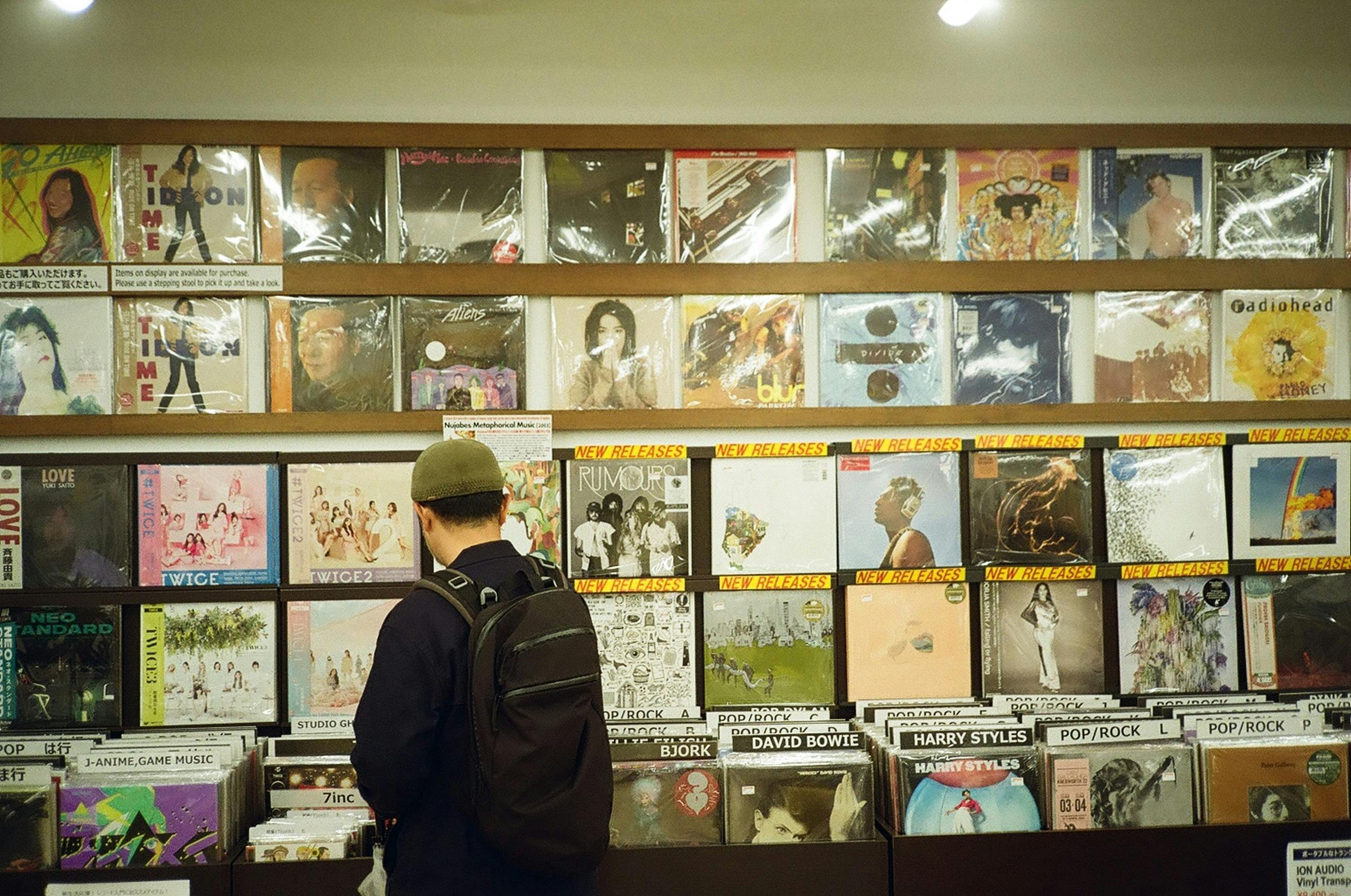 Man browsing vinyl records in a vintage store