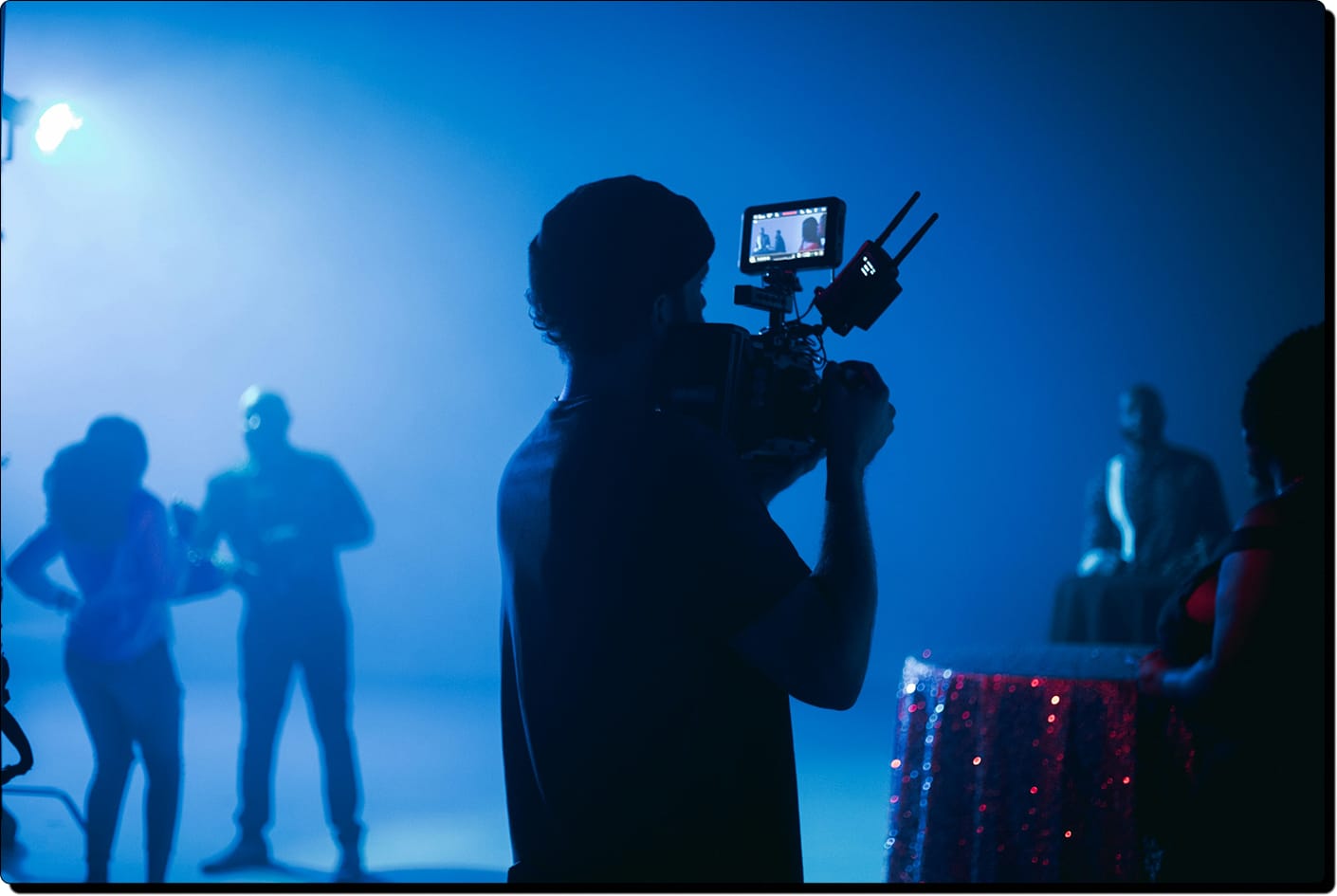 Cinematographer filming a music video