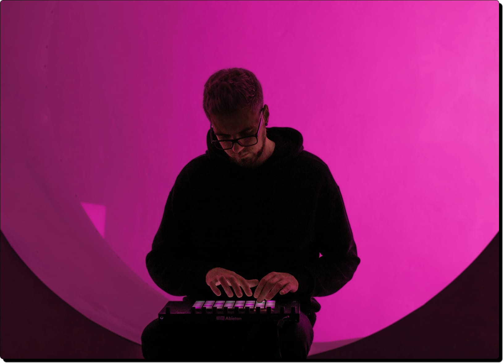 Music producer in pink room