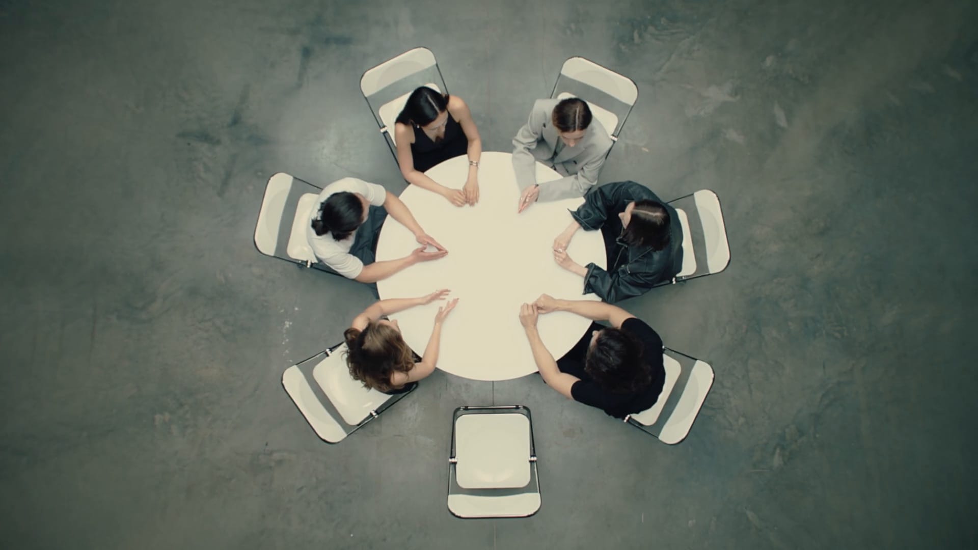 Group of people sitting at a round table