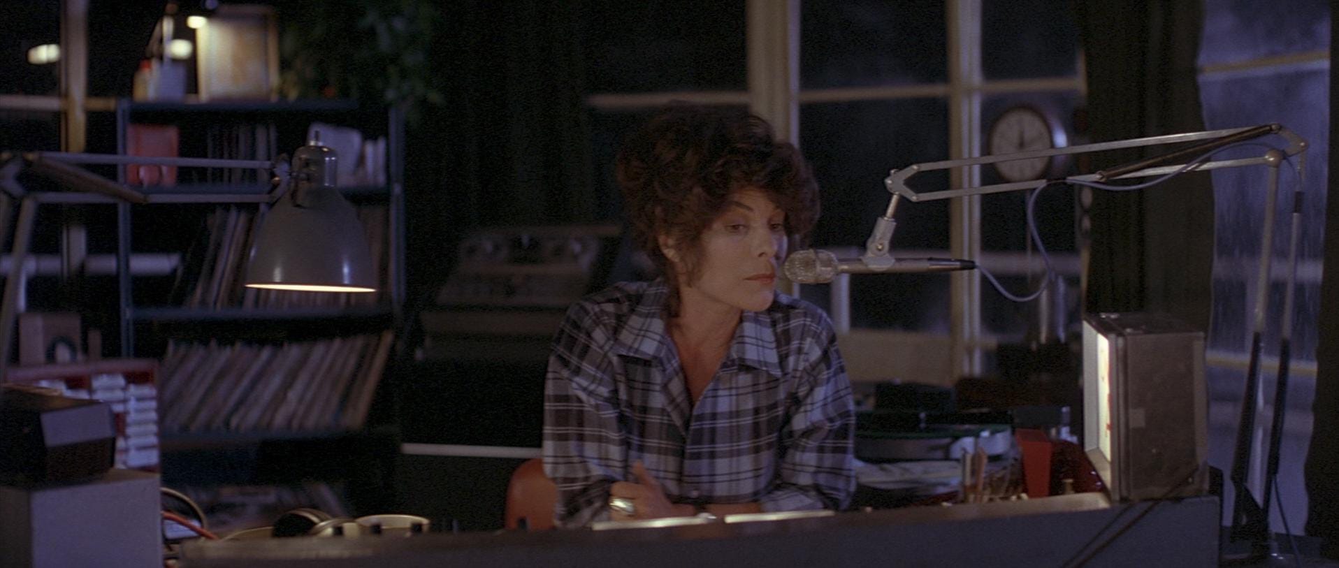Woman on a radio show talking into a microphone