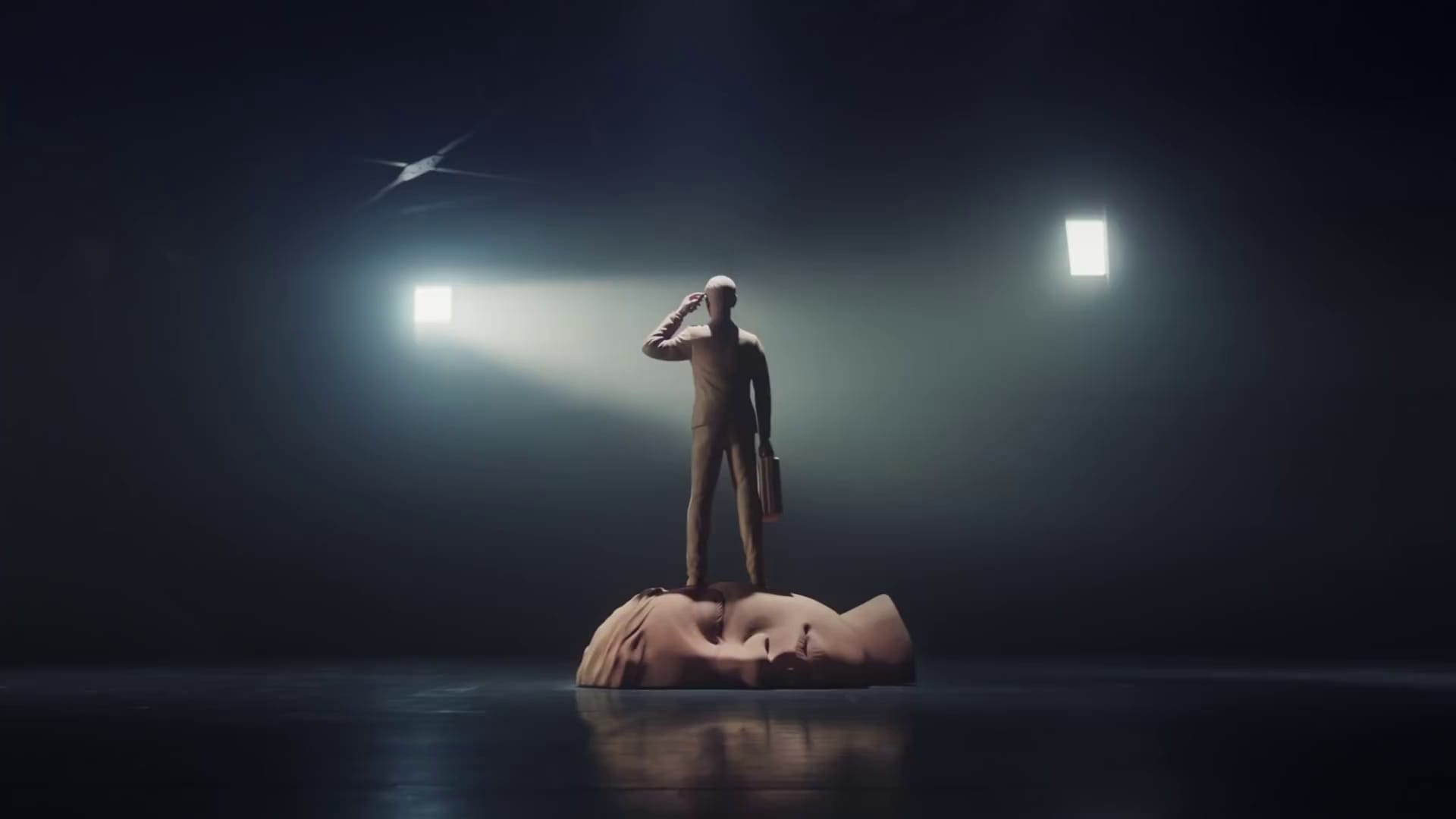 Human figure stepping on a face in the ground
