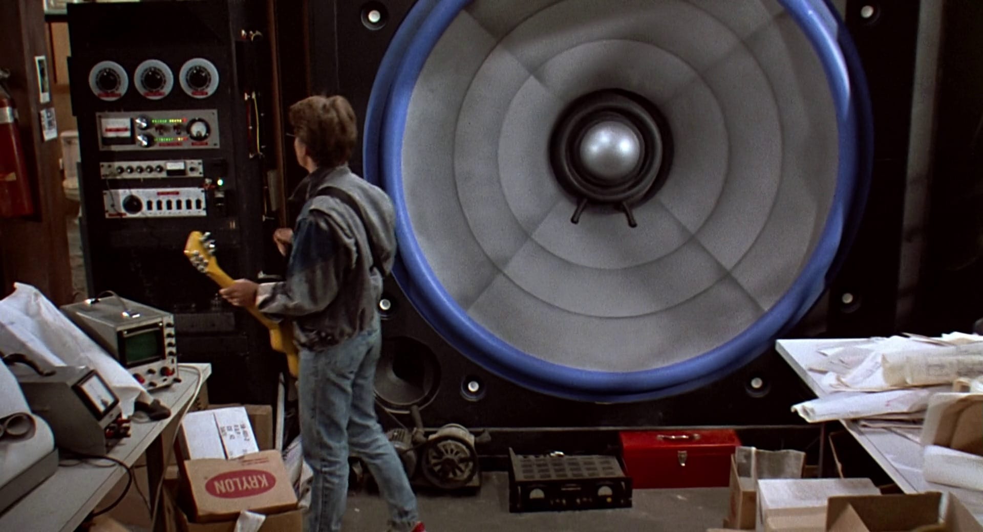 Man standing in front of a giant speaker